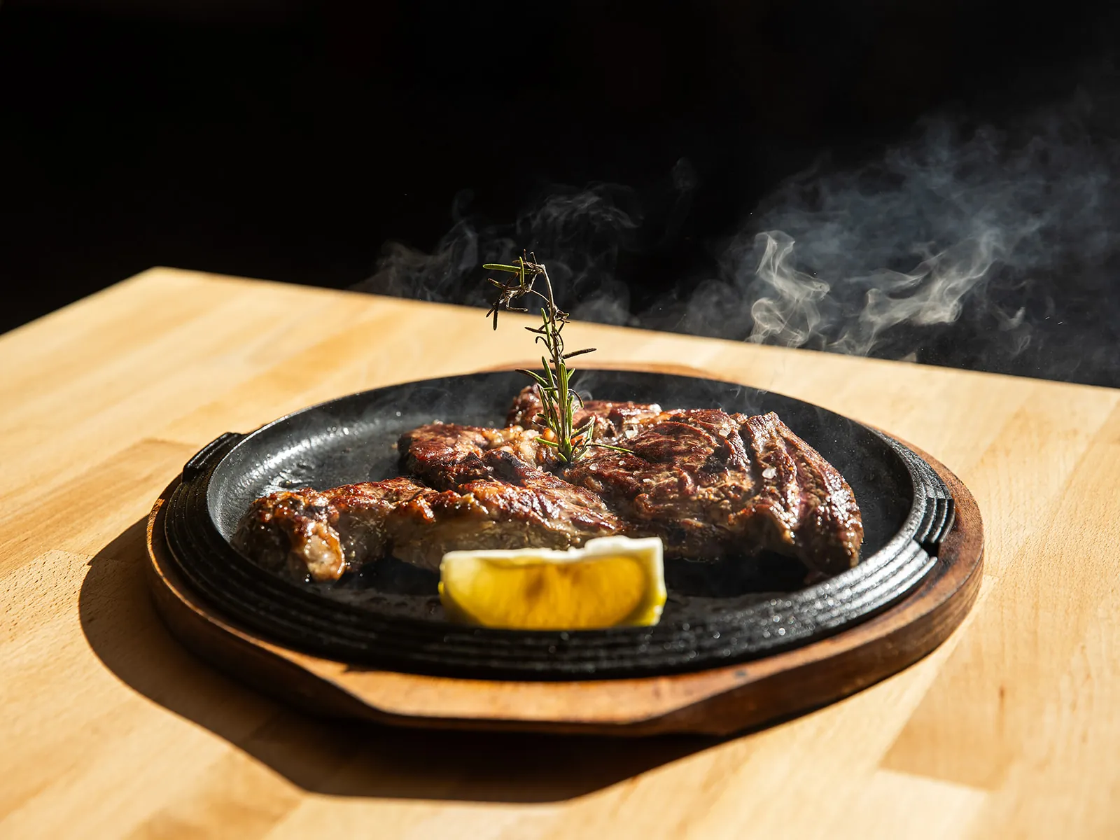 Sliced beef steaming on the plate